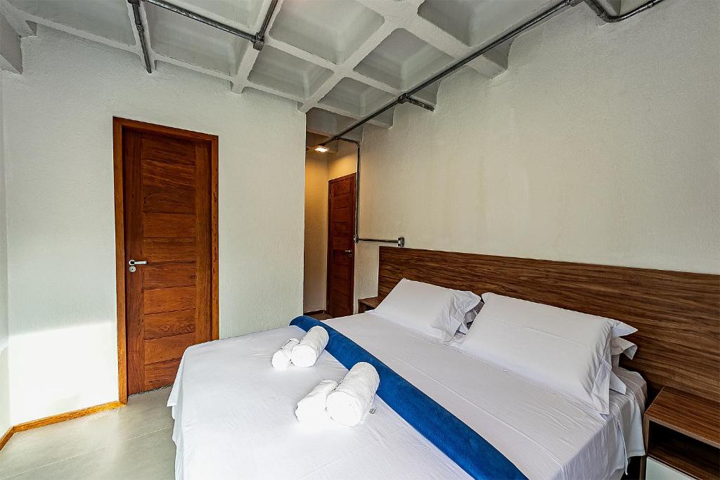 Postel nebo postele na pokoji v ubytování Antiquus ApartHotel