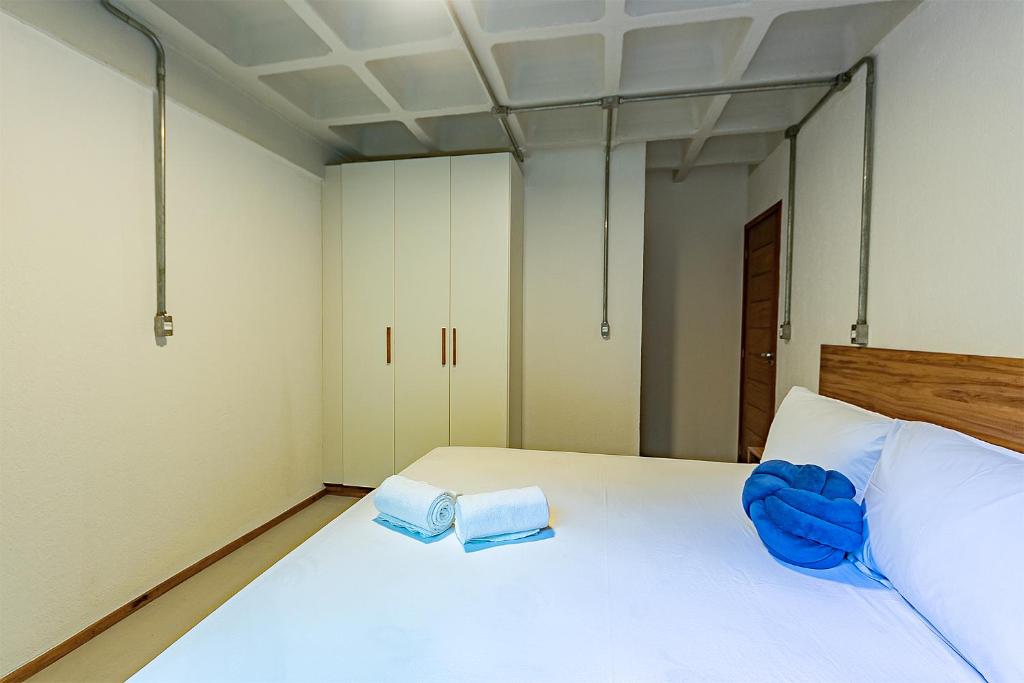 Postel nebo postele na pokoji v ubytování Antiquus ApartHotel