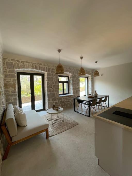 a living room with a couch and a table at Villa Kapela in Zlarin
