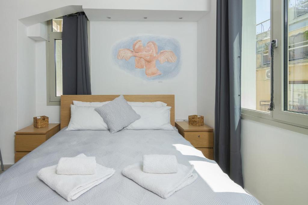 A bed or beds in a room at Nereid Apartment