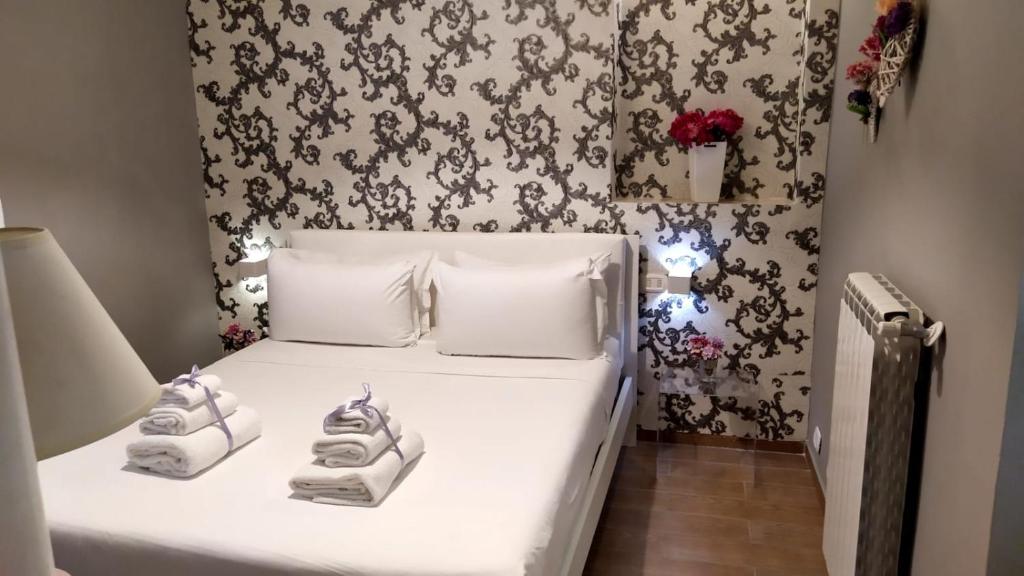 Postel nebo postele na pokoji v ubytování Il Roseto