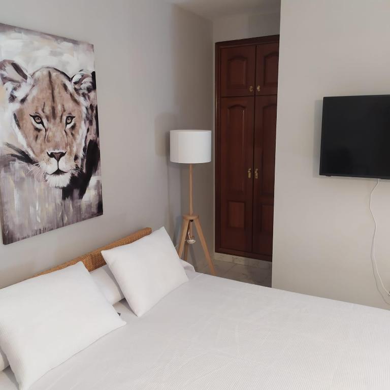Postel nebo postele na pokoji v ubytování La Palmera Rooms
