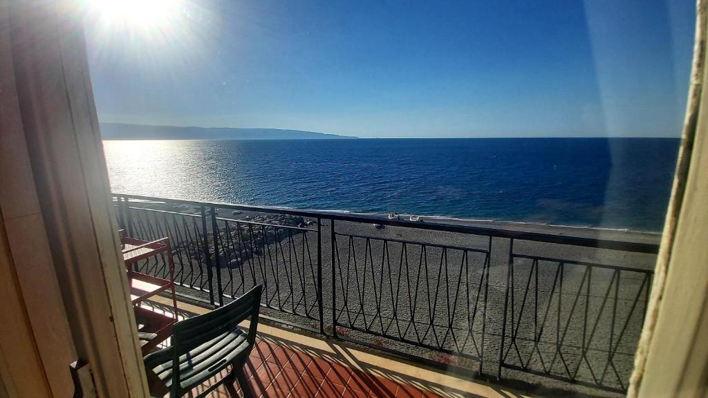 a view of the ocean from a balcony at Nido Azzurro in Scaletta Zanclea