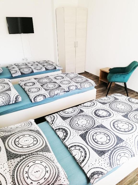 Postel nebo postele na pokoji v ubytování Apartmány Plzeň Zábělá 69