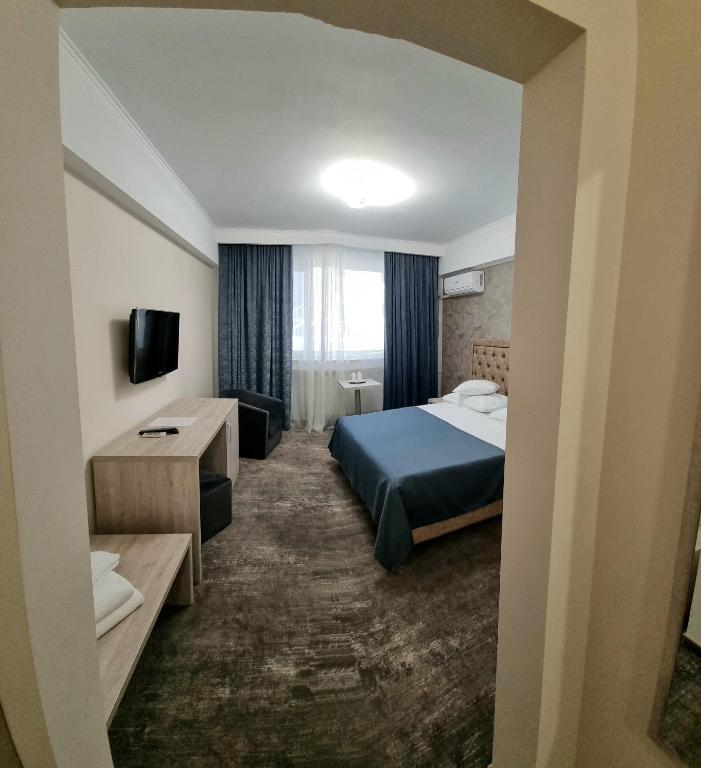 Postel nebo postele na pokoji v ubytování Hotel Tiara
