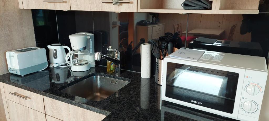 Kuchyň nebo kuchyňský kout v ubytování Chalet Sunnmätteli