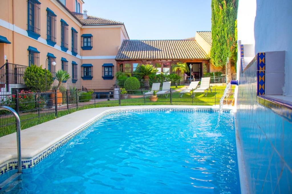 a swimming pool in the middle of a building at YIT Vereda Real in Valencina de la Concepción