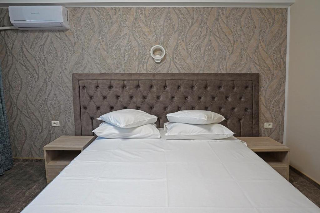 Postel nebo postele na pokoji v ubytování Hotel Tiara
