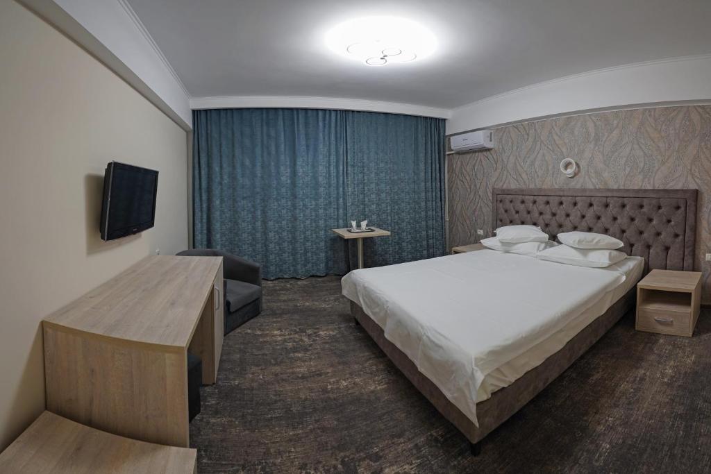 Postel nebo postele na pokoji v ubytování Hotel Tiara