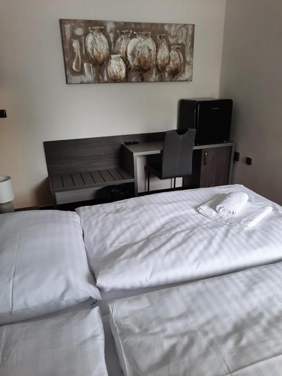 Postel nebo postele na pokoji v ubytování Hotel Orka