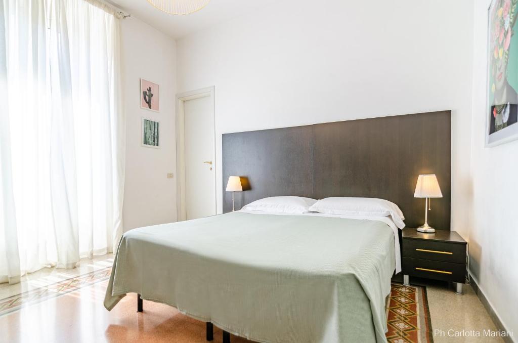 A bed or beds in a room at El Dorado Colosseum