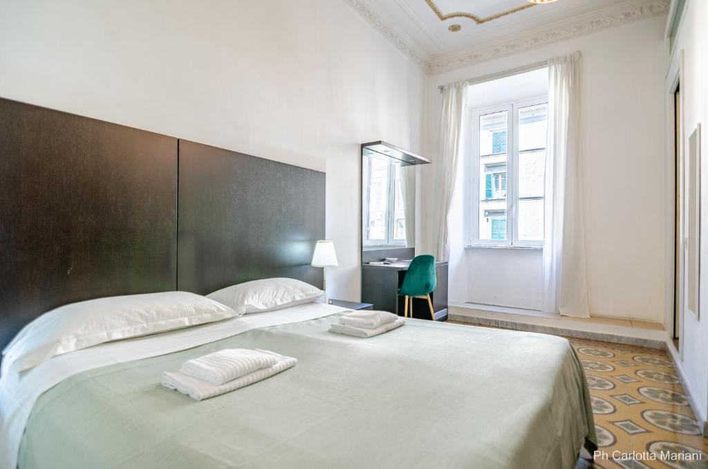A bed or beds in a room at El Dorado Colosseum