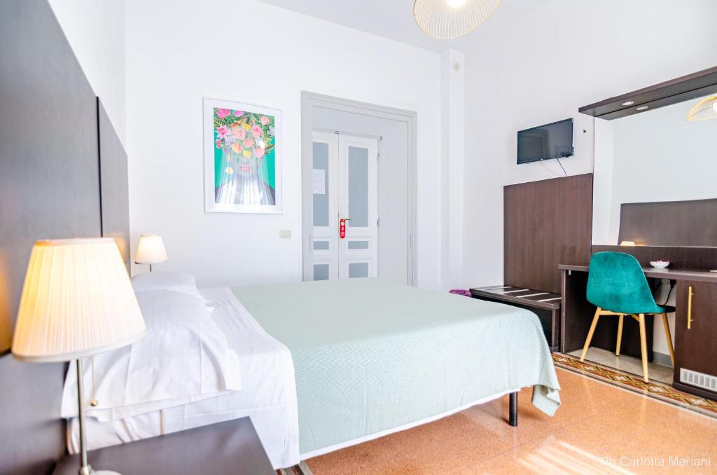 A bed or beds in a room at El Dorado Colosseum