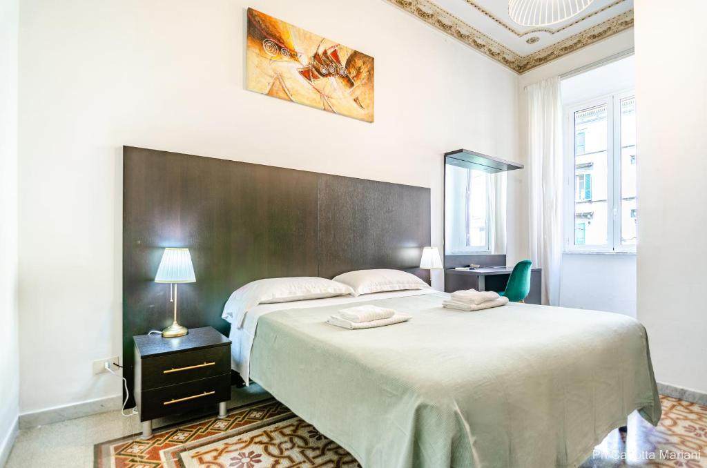 A bed or beds in a room at El Dorado Colosseum