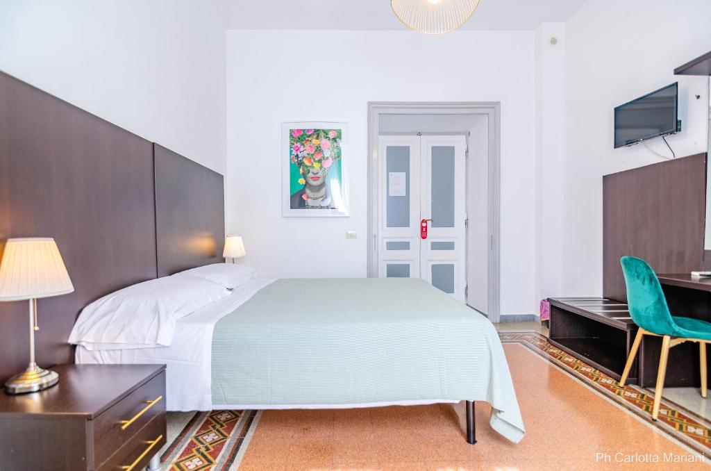A bed or beds in a room at El Dorado Colosseum