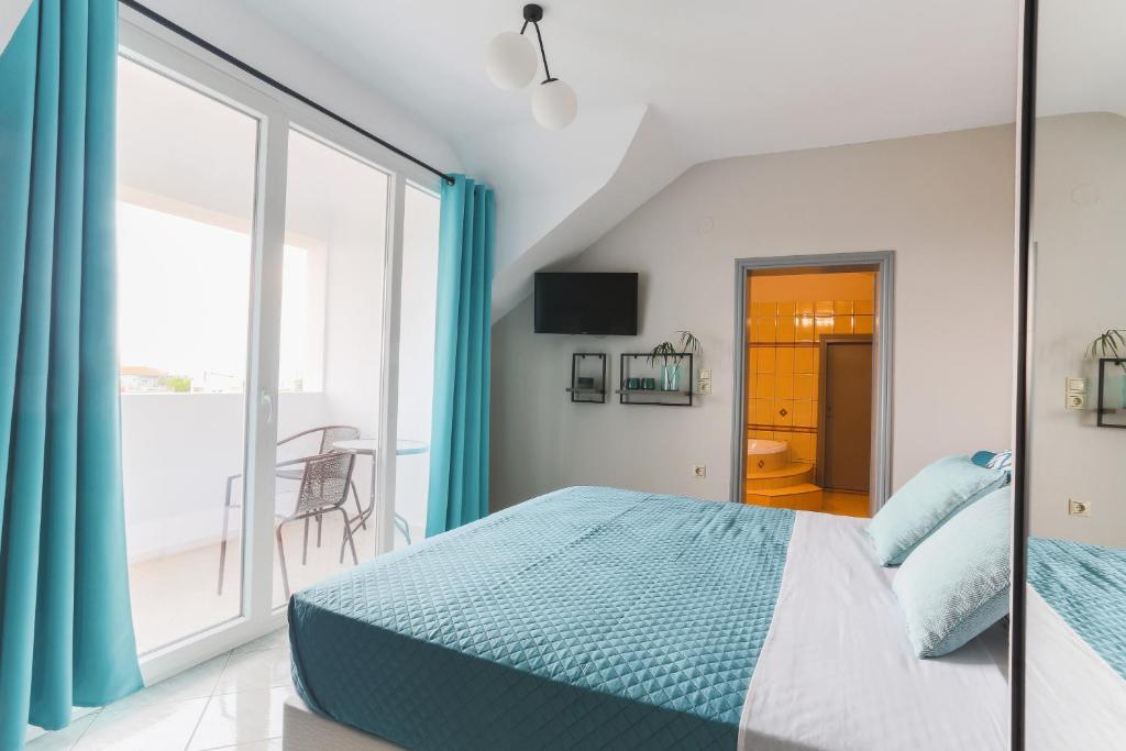 Voodi või voodid majutusasutuse Joya Ofrynio Stylish Suites toas