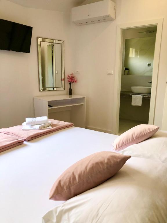 Postel nebo postele na pokoji v ubytování Hotel B&B CHAMBERLAIN