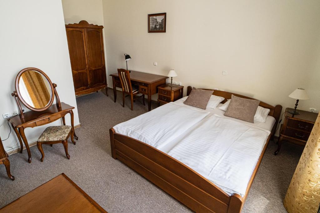 Postel nebo postele na pokoji v ubytování Hotel Polonia