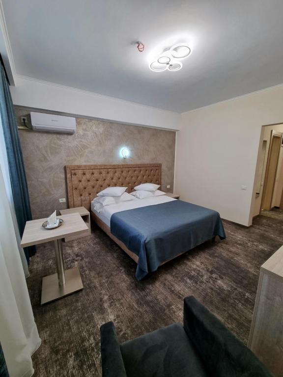 Postel nebo postele na pokoji v ubytování Hotel Tiara