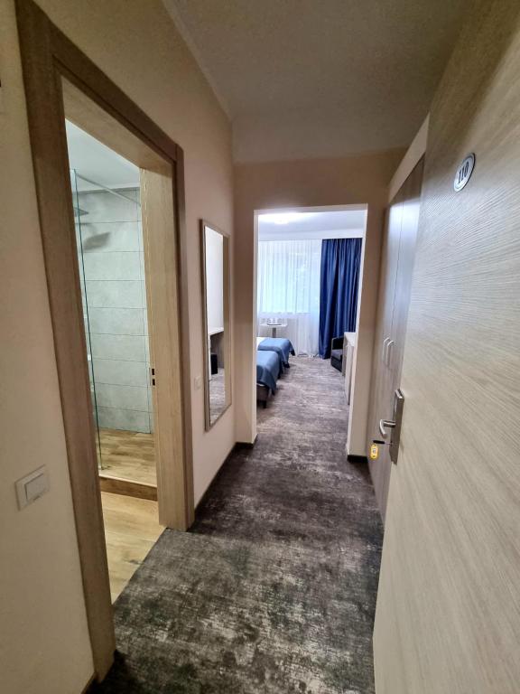 Postel nebo postele na pokoji v ubytování Hotel Tiara