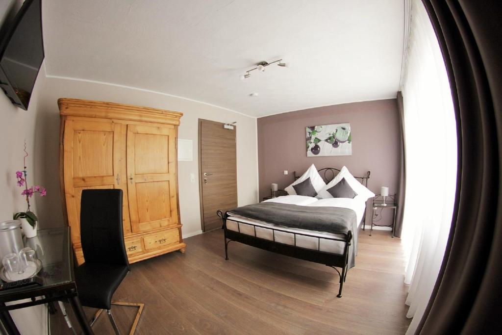 Postel nebo postele na pokoji v ubytování Apado-Hotel garni