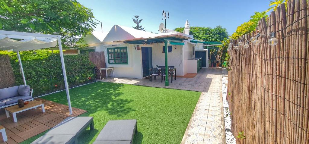 A garden outside Bungalows Playa Flor, Campo Internacional, Maspalomas.