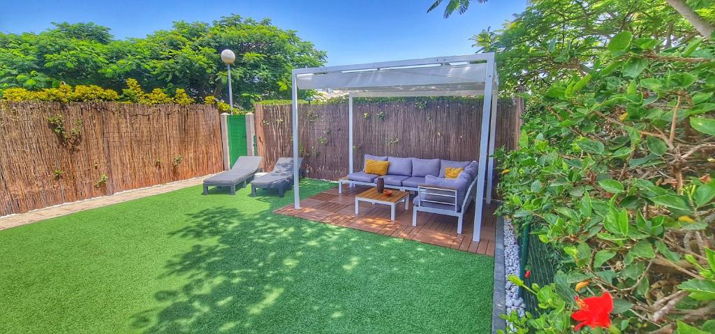 A garden outside Bungalows Playa Flor, Campo Internacional, Maspalomas.