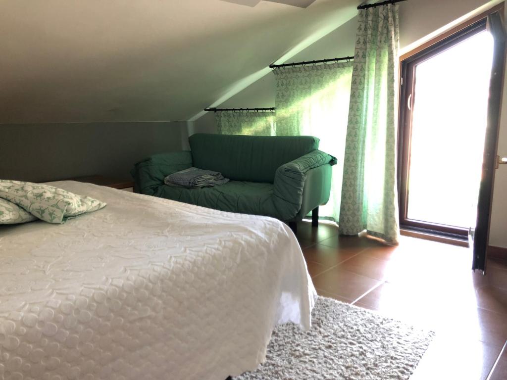 A bed or beds in a room at DaCapo Rooms