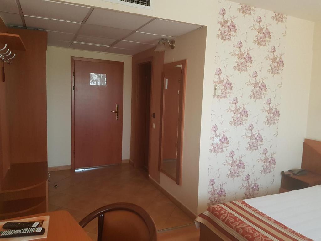 Postel nebo postele na pokoji v ubytování Hotel Transit