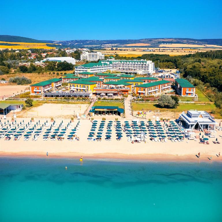 an aerial view of a beach with chairs and umbrellas at ECO Therma Village - Private Beach & Free Parking in Kranevo