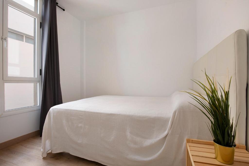 A bed or beds in a room at Apartamento Playa Morro Jable 2c
