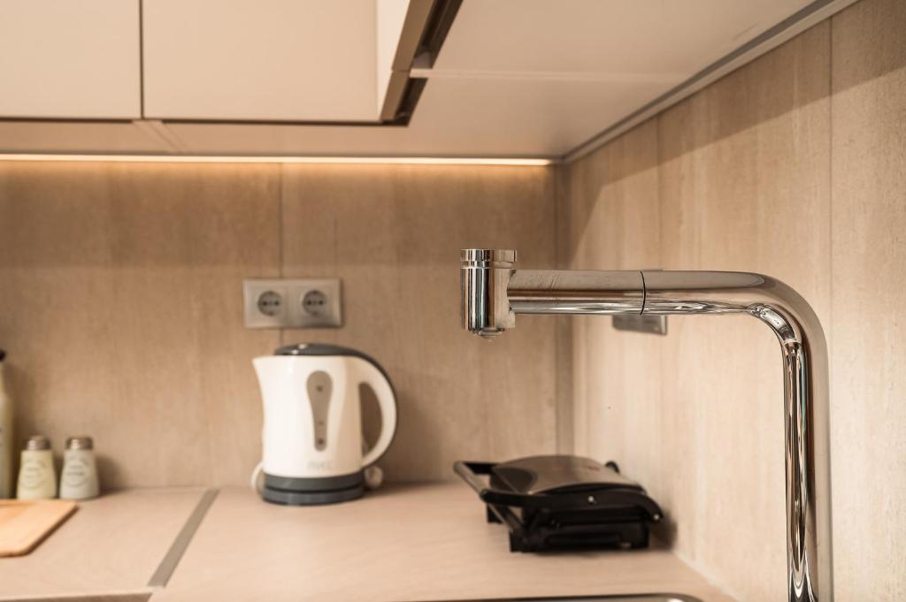 Coffee and tea making facilities at ModernPastel Apartment - Private Parking,Near the Old Port