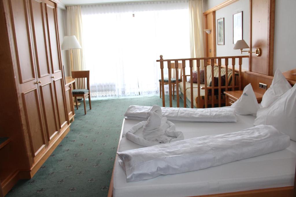 Postel nebo postele na pokoji v ubytování Alpina Mountain Resort