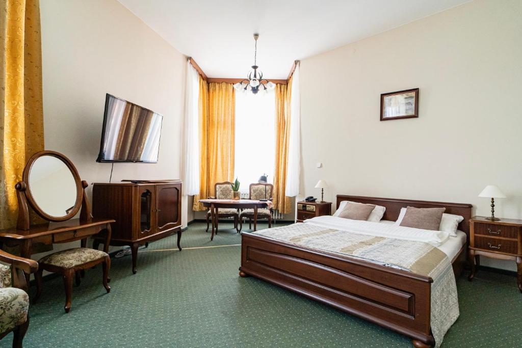 Postel nebo postele na pokoji v ubytování Hotel Polonia