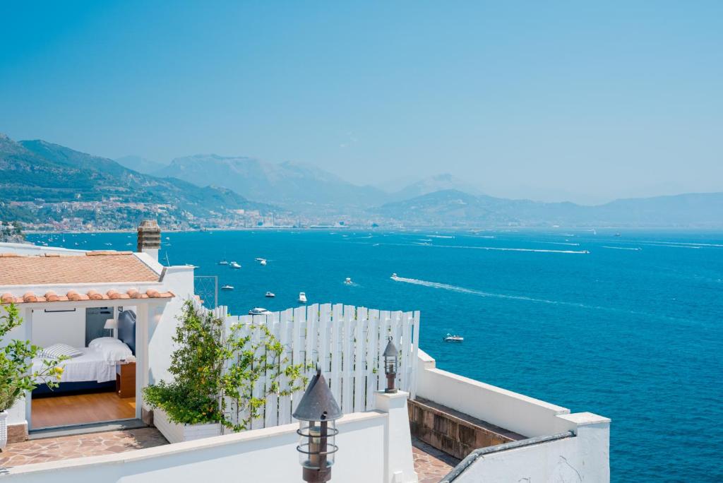 a bedroom with a view of the water at La Vecchia Portineria in Cetara