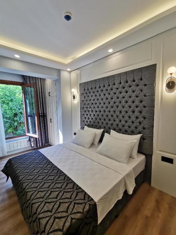 Postel nebo postele na pokoji v ubytování Luxx Garden Hotel