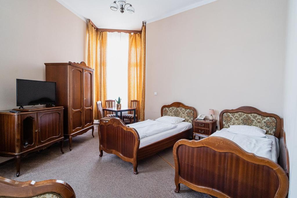 Postel nebo postele na pokoji v ubytování Hotel Polonia