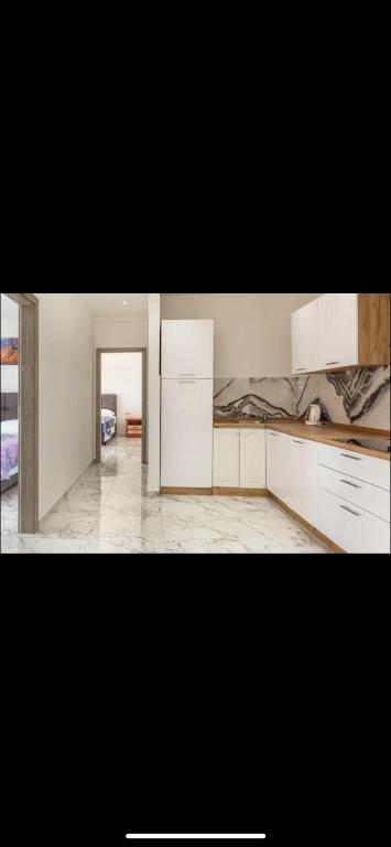 Kuchyň nebo kuchyňský kout v ubytování Apartments Arijan30