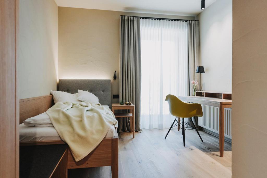 Postel nebo postele na pokoji v ubytování Hotel Alpenrose