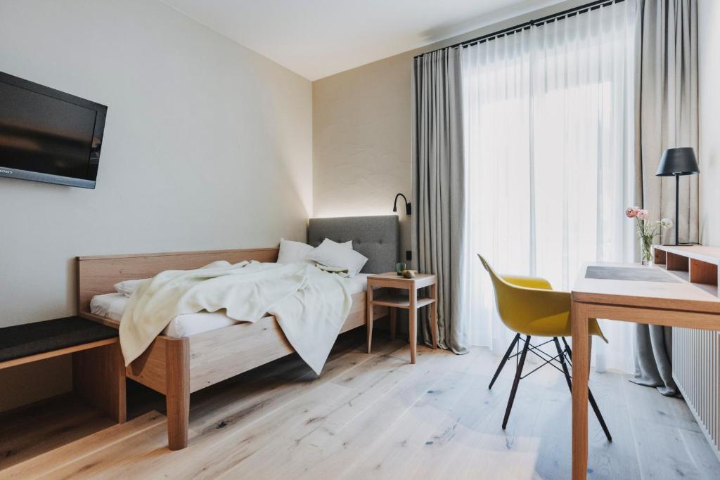 Postel nebo postele na pokoji v ubytování Hotel Alpenrose