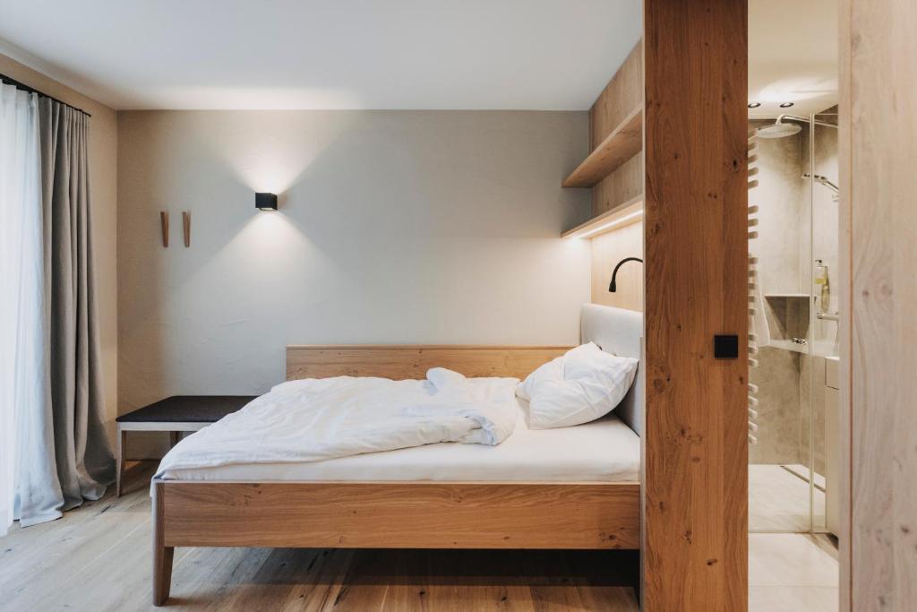 Postel nebo postele na pokoji v ubytování Hotel Alpenrose