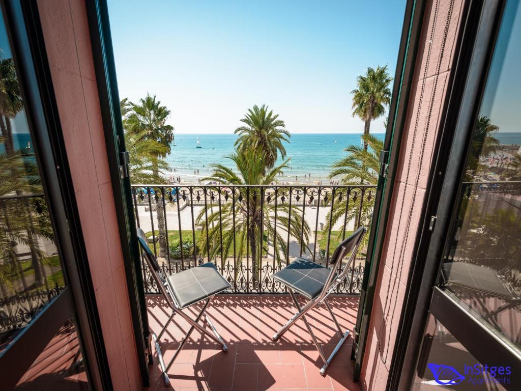 a view of the beach from a balcony at InSitges Ribera's Beach in Sitges