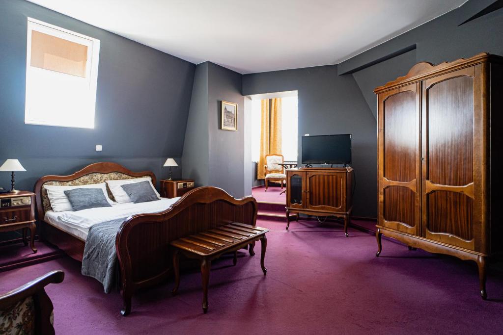 Postel nebo postele na pokoji v ubytování Hotel Polonia