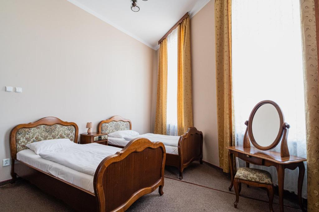 Postel nebo postele na pokoji v ubytování Hotel Polonia