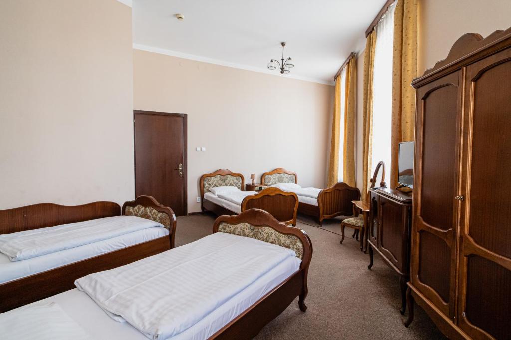 Postel nebo postele na pokoji v ubytování Hotel Polonia