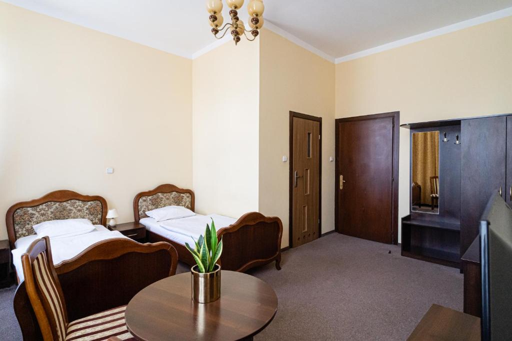Postel nebo postele na pokoji v ubytování Hotel Polonia