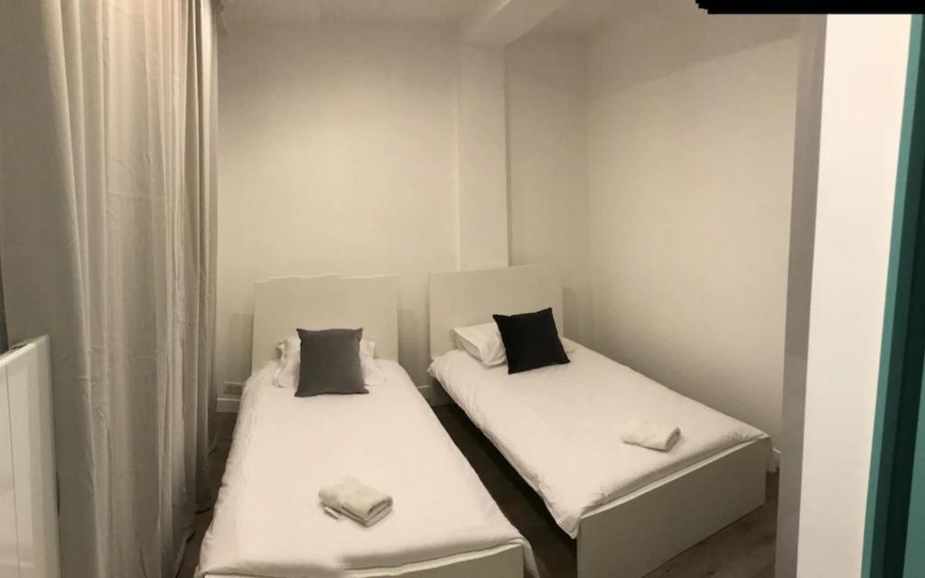 Posteľ alebo postele v izbe v ubytovaní Elégant appartement dans le quartier Concorde à Paris