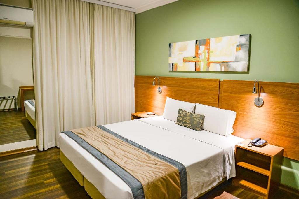 Ένα ή περισσότερα κρεβάτια σε δωμάτιο στο Comfort Hotel Bauru