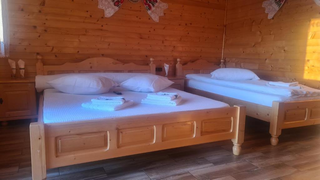 Postel nebo postele na pokoji v ubytování Pensiunea Anisoara