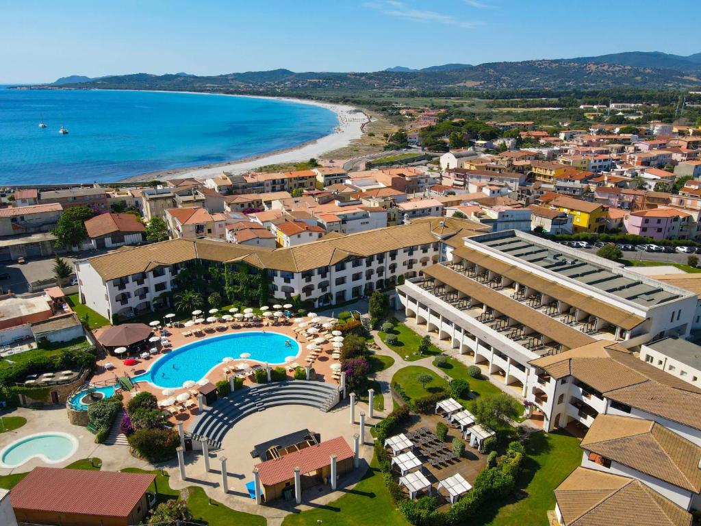 an aerial view of a resort and the beach at Cala Della Torre Resort in La Caletta